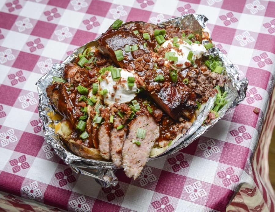 The Big Poppa ($19.95) is a baked potato with sausage, brisket and a rib. (Courtesy SouthernQ BBQ and Catering)