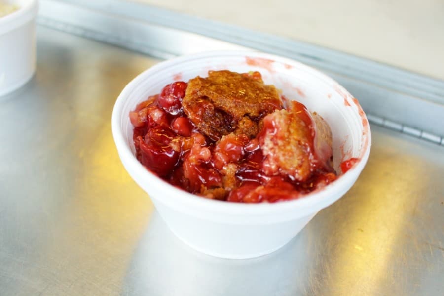 The cherry ginger cobbler ($5) is one of several cobblers that rotate through the truck. Others include cinnamon peach and bananas foster cobblers. (Kelly Schafler/Community Impact Newspaper)