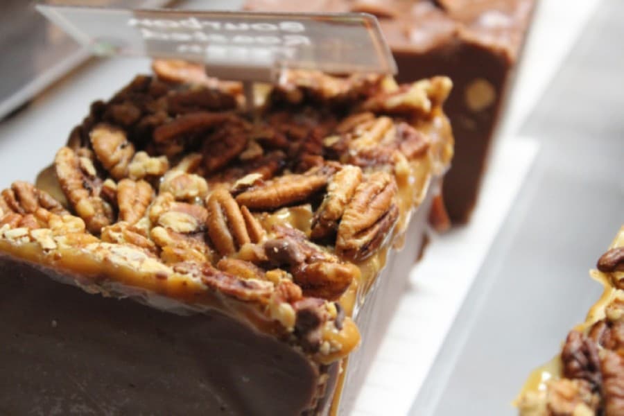 Many available sweets have alcohol-infused alternatives. The pecan turtles also come in a bourbon-flavored variety. (Sandra Sadek/Community Impact Newspaper)