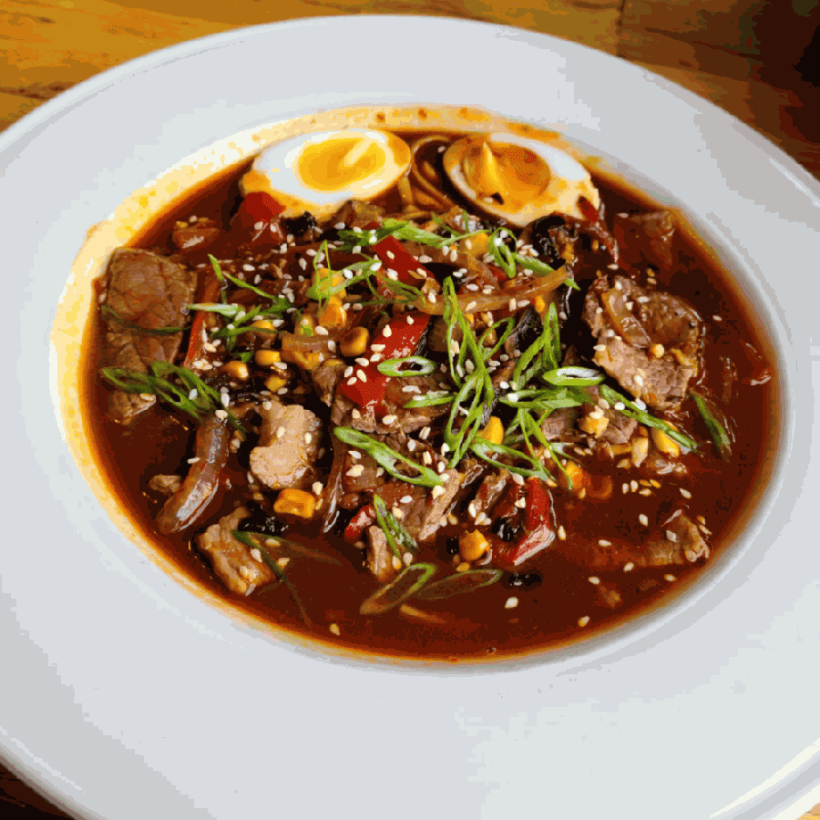 Spicy beef and vegetable ramen is served with a soft-boiled egg. (Courtesy Didi's Downtown)