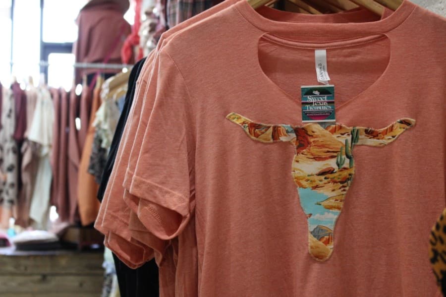 According to Calhoun, the boutique specializes in apparel customized with hand-made patches that come in a variety of colorful fabrics and Texas-inspired shapes. (Adriana Rezal/Community Impact Newspaper)
