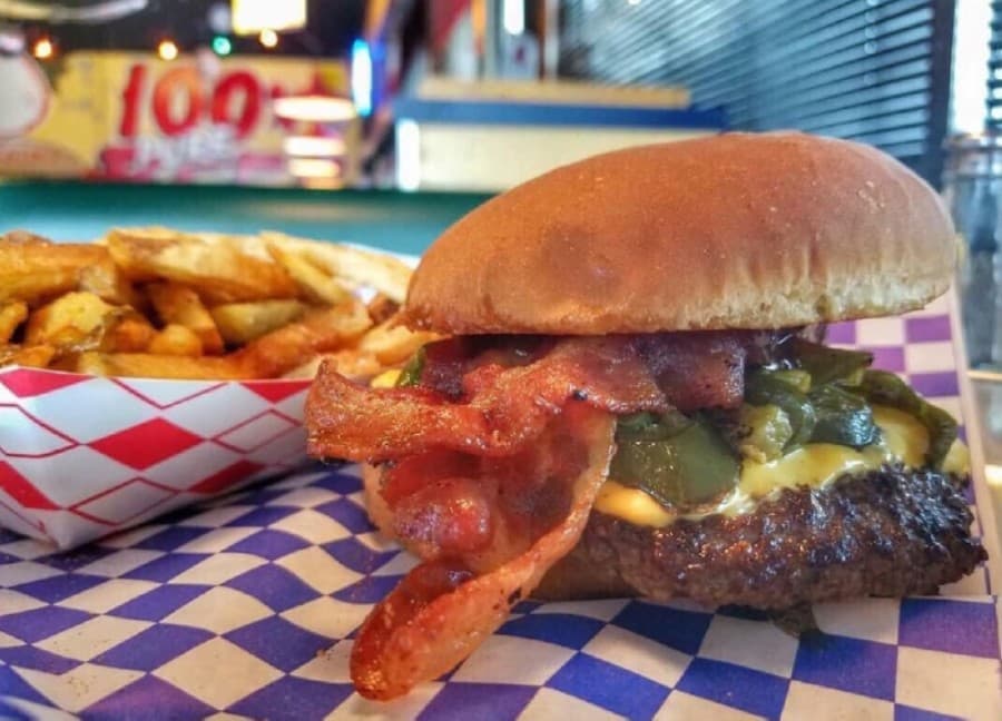 The Western B-B-Q Burger features grilled jalapenos, crispy bacon, American cheese and hickory barbecue sauce. (Courtesy Meteor Hamburgers)
