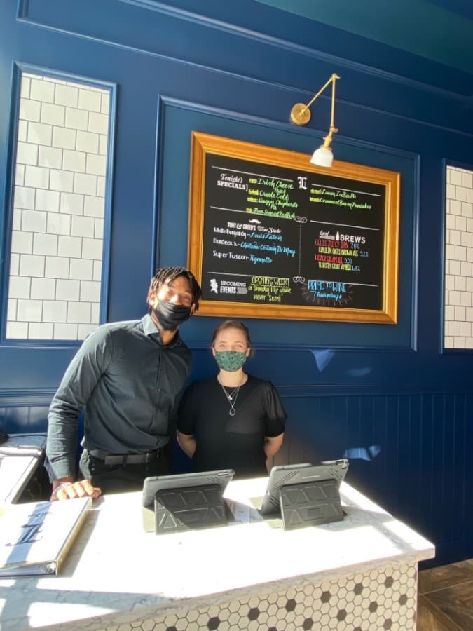 Employees work at the restaurant's grand opening. (Phyllis Campos/Community Impact Newspaper)