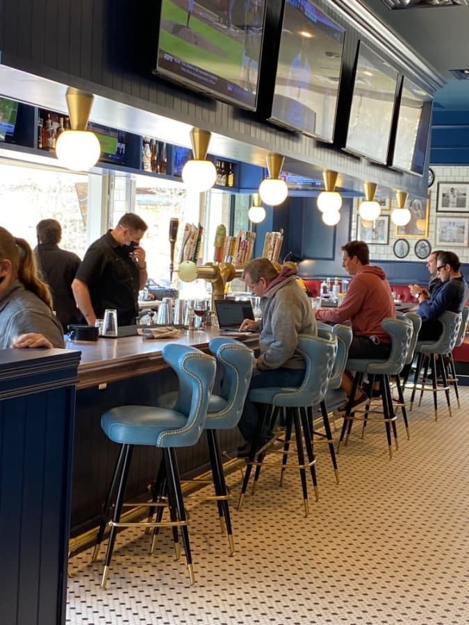 The location includes a bar area with a more expansive alcohol selection than other locations. (Phyllis Campos/Community Impact Newspaper)