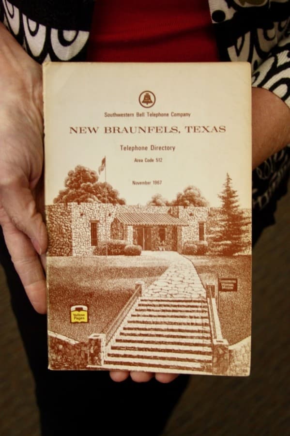 The first museum building is shown on a local phone book. (Lauren Canterberry/Community Impact Newspaper)