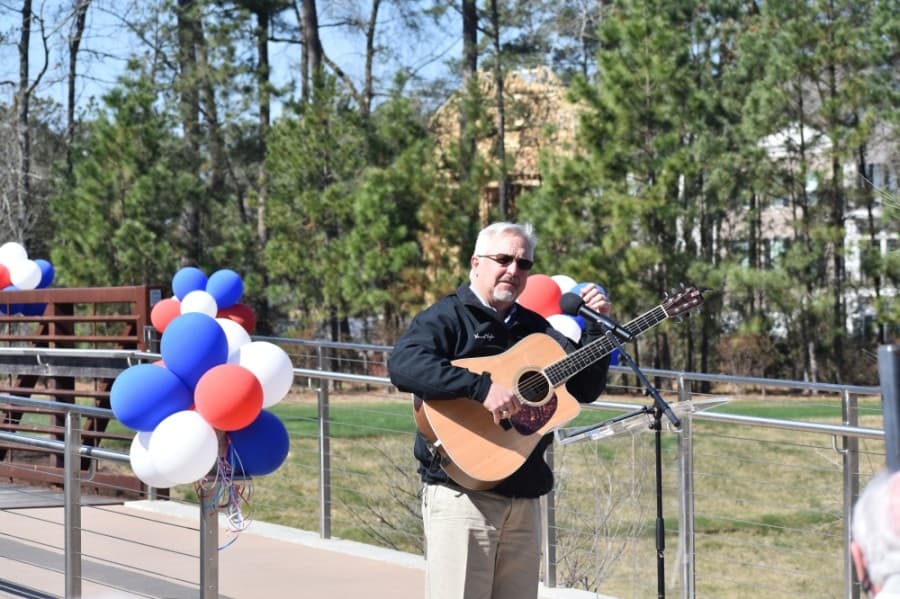 Bridge dedication ceremonies were capped with a humorous song about Heineman's legacy to the tune of "American Pie." (Vanessa Holt/Community Impact Newspaper"