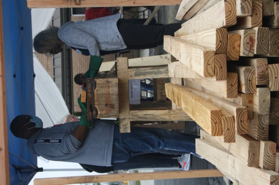 Volunteers work together to build beds for local children. (Danica Lloyd/Community Impact Newspaper)
