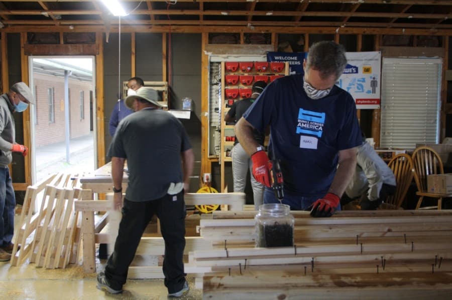 Mark Proelger of the Northwest Houston chapter serves at a build event. (Danica Lloyd/Community Impact Newspaper)