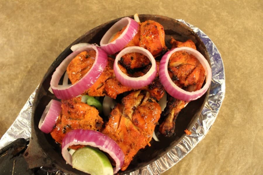 Fusion India, or F2-Fusion Flavors, has Chicken Tandoori (3.99) that is cooked in a clay oven called a tandoor. (Sandra Sadek/Community Impact Newspaper)