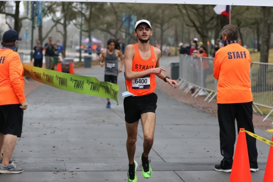 After completing the race at The Woodlands Waterway finish line, runners entered a zone where they could resume wearing a face covering. (Photos courtesy FinisherPix)