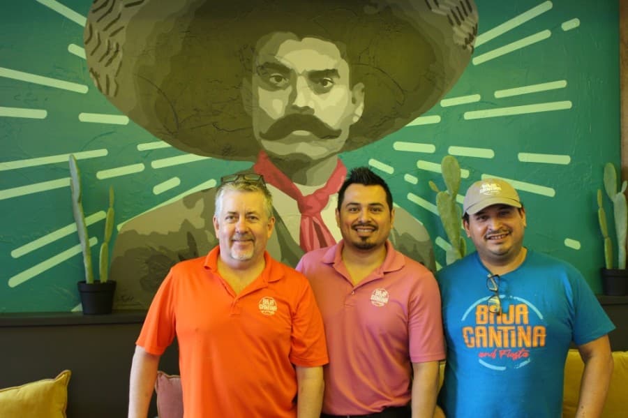 Kevin Crowell is joined by managing partner Ismael Hernandez and Elber Rodriguez. (Andrew Christman/Community Impact Newspaper)