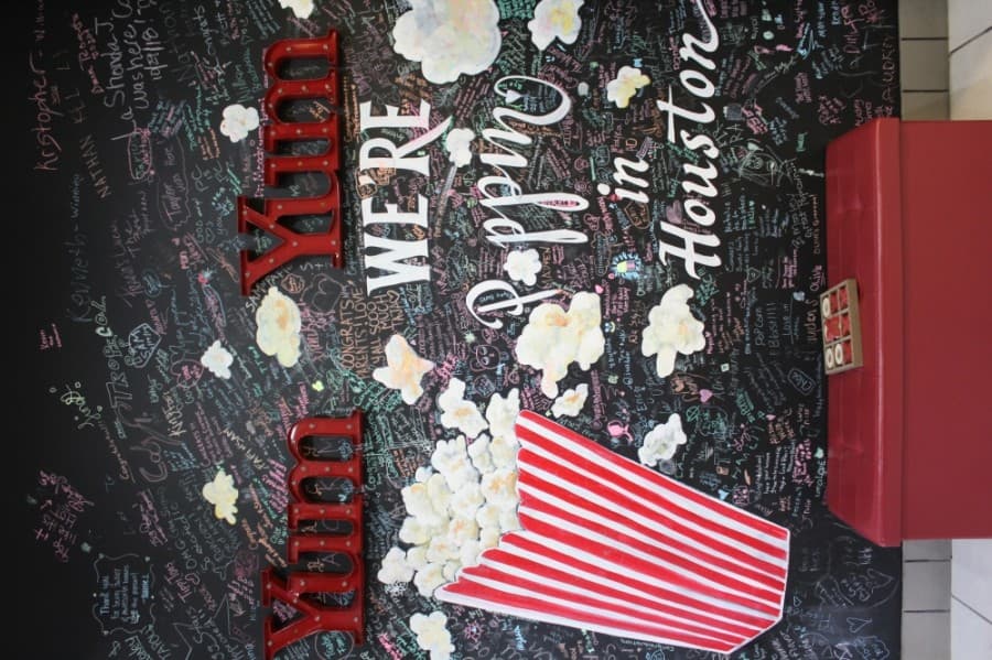 


Customers who stop by Popcorn Blast can add a message to a chalk wall in the business.