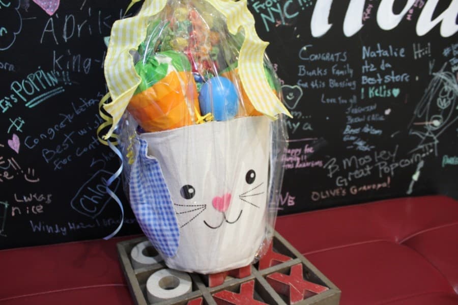 In addition to bagged popcorn, the shop also sells popcorn in specialty tins that can be refilled, including this themed tin for Easter. (Shawn Arrajj/Community Impact Newspaper)