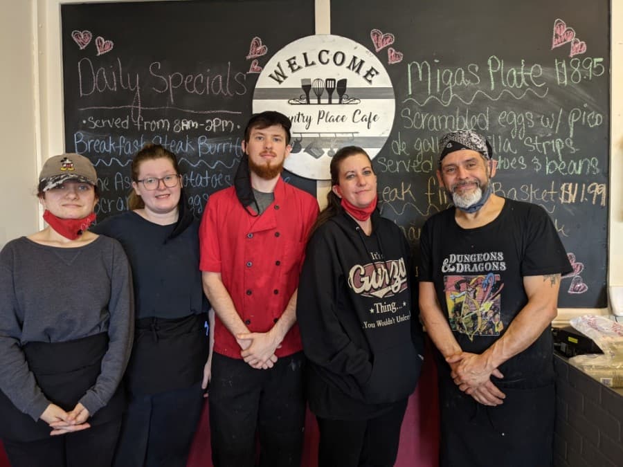 From right, Victor and Kelly Garza and their children Zach, Darien and Delaney Florek run Country Place Cafe. (Photos by Jake Magee/Community Impact Newspaper)