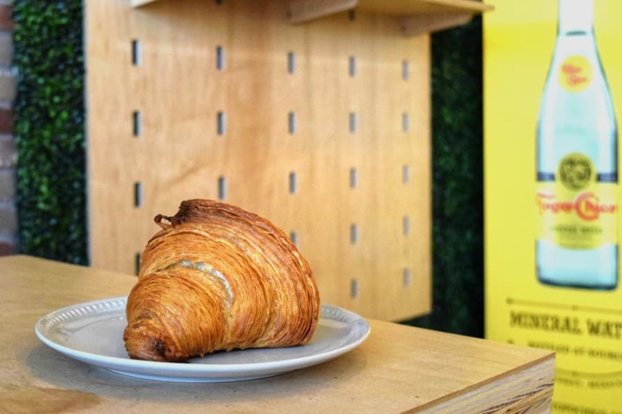 The classic butter croissant is the base for many dishes served at Daily Grinds. (Matt Payne/Community Impact Newspaper)
