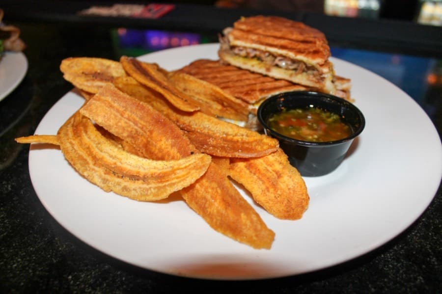 The Cuban ($12.99) comes with pulled pork and ham and is served with a side of plantains. (Andy Li/Community Impact Newspaper)