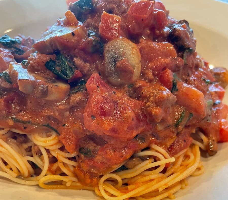 La Nona ($4) features angel hair pasta tossed with mushrooms, spinach and homemade tomato cream meat sauce. (Courtesy Raymond Green)
