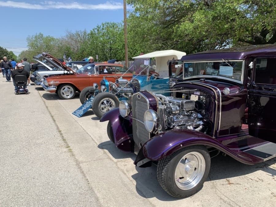 Classic cars parked on Main Street for the car show April 17. (Megan Cardona/Community Impact Newspaper)