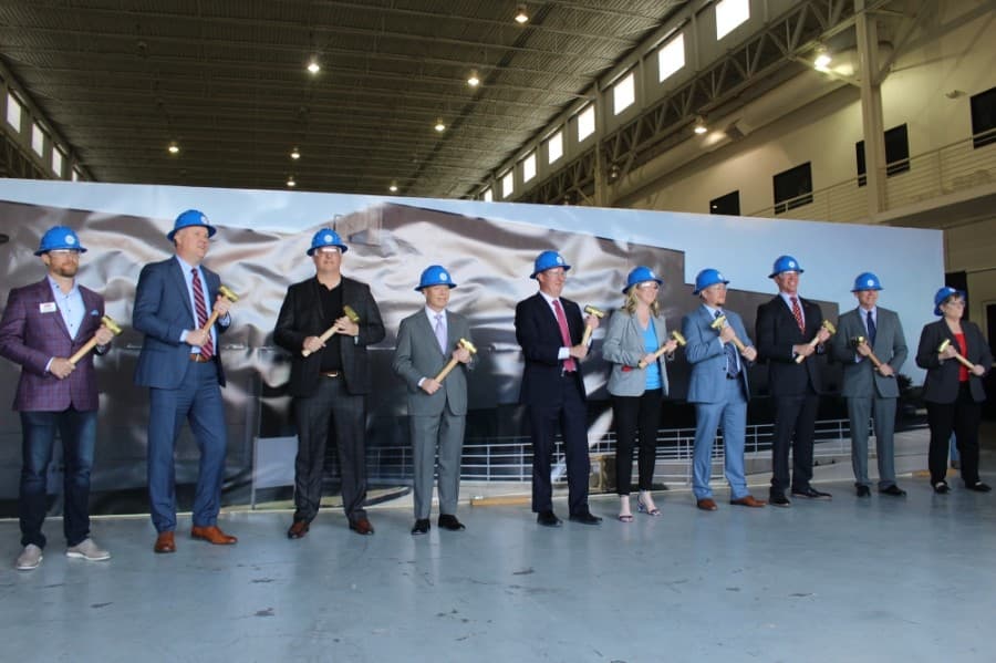 Frisco officials pose for a photo with their hammers and helmets at the groundbreaking ceremony April 20. (Miranda Jaimes/Community Impact Newspaper)