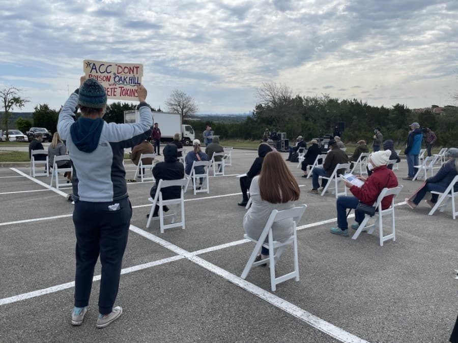 Protesters held signs reading "Don't poison Oak Hill" on April 17. (Nicholas Cicale/Community Impact Newspaper)
