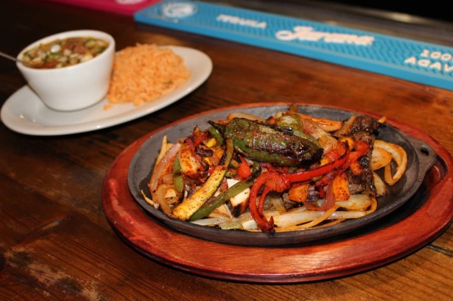 The restaurant is specializes in grilled plates such as the Del Mar Fajitas ($18.99), which include grilled shrimp and beef fajita served with Mexican rice and beans. (Adriana Rezal/Community Impact Newspaper)