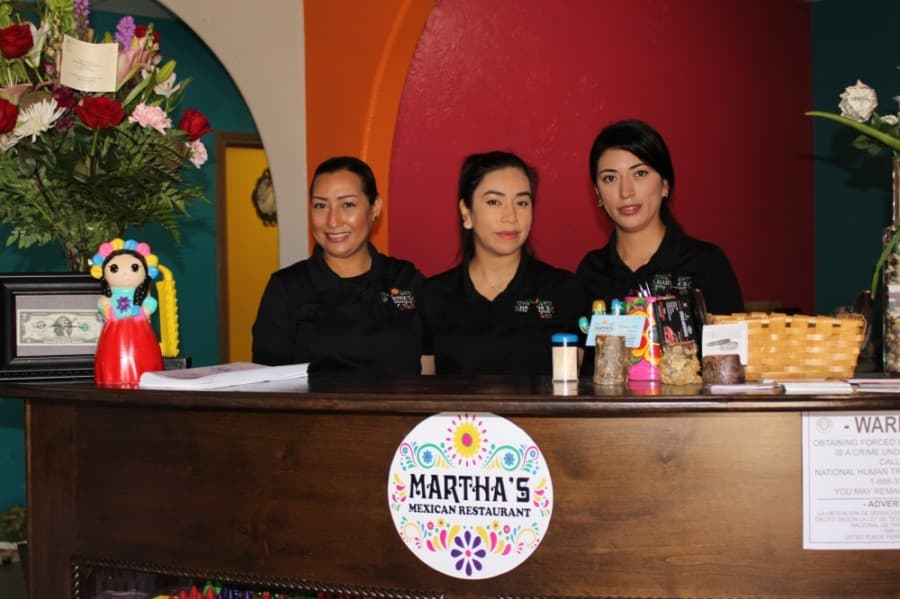 Business owners Martha Gámez (left), Blanca Luna (middle) and Karina Luna (right) operate Martha's Mexican Restaurant & Grill on Alma Street in Tomball. (Adriana Rezal/Community Impact Newspaper)