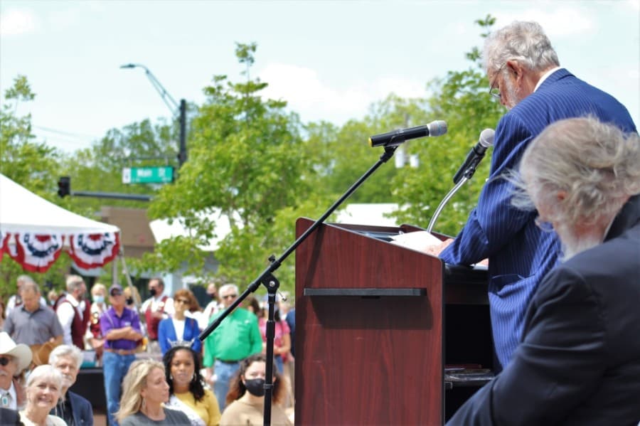 Grapevine Mayor William D. Tate addresses guests during the grand opening celebration of Grapevine Main Station. (Sandra Sadek/Community Impact Newspaper)