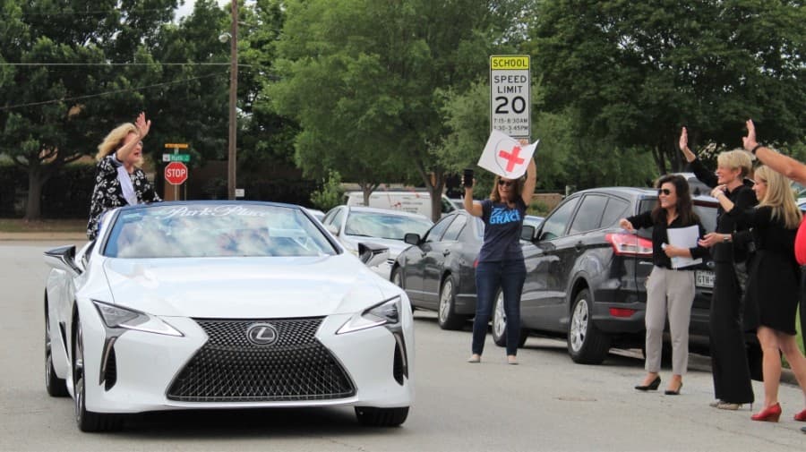 Coworkers hosted a surprise parade for Shirley Roberts prior to the virtual celebration to congratulate her. (Sandra Sadek/Community Impact Newspaper)