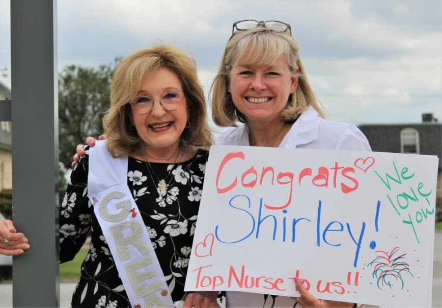 From left: Shirley Roberts, clinic nurse manager, and Stacy Pacholick, director of programs, pose for a photo before the virtual celebration. (Sandra Sadek/Community Impact Newspaper)