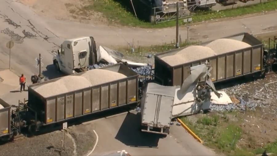 Train splits 18-wheeler carrying bottled water in Richmond