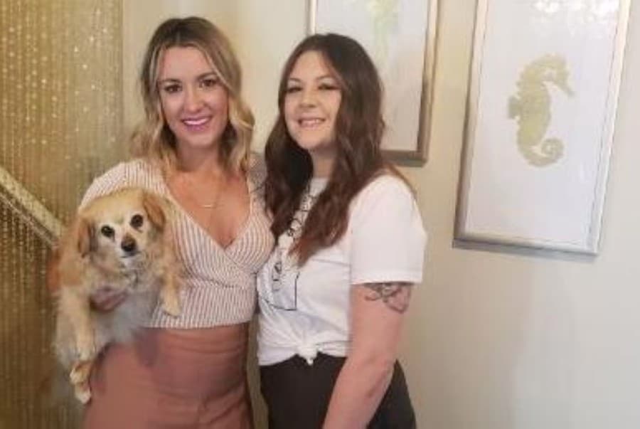 two women and dog