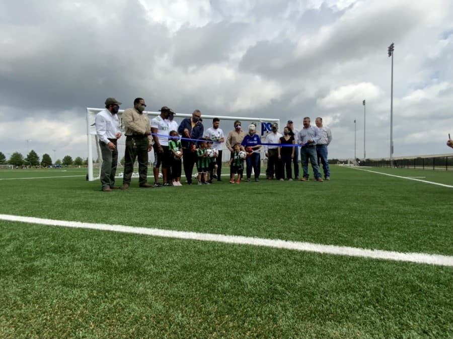 A ribbon cutting for the new synthetic turf athletic fields was held May 8. (Courtesy Travis County)