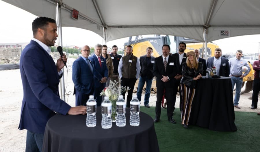 Derrick Evers, left, gives closing comments during the groundbreaking ceremony. (Courtesy Integrate Agency)