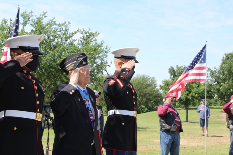 three men saluting
