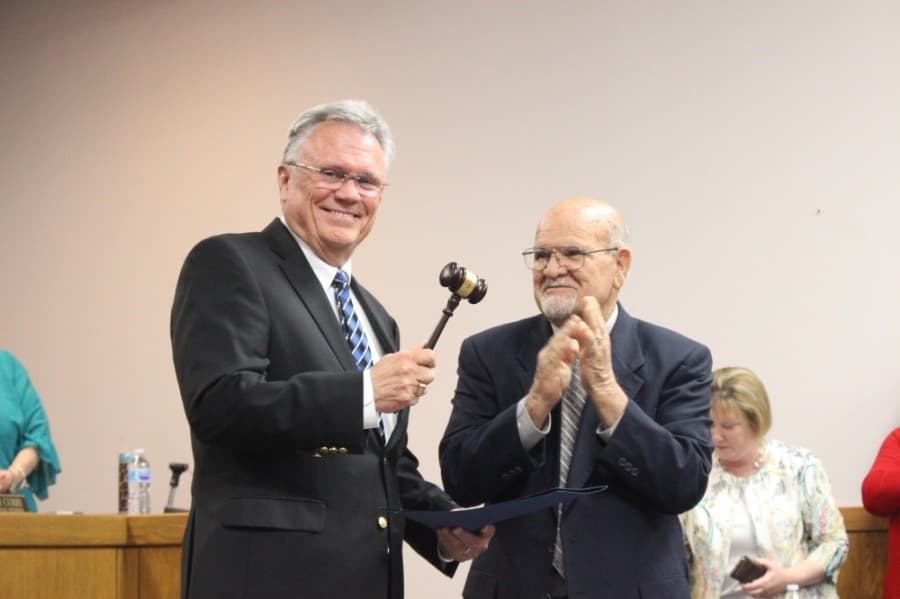 Aaron (right) gifted Funderburk (left) with his own gavel. (Kelly Schafler/Community Impact Newspaper)