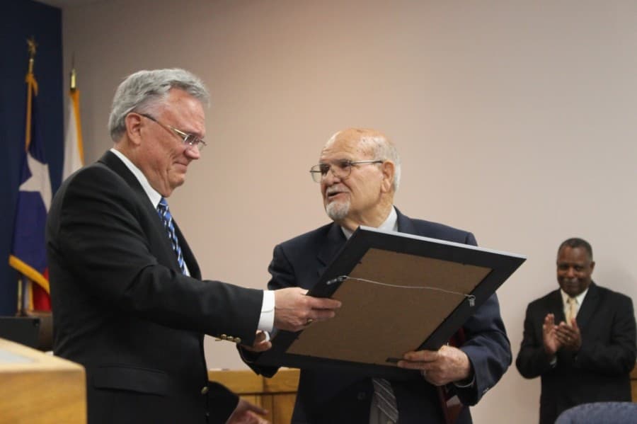 Funderburk (left) gifted Aaron (right) a proclamation from the city. (Kelly Schafler/Community Impact Newspaper)