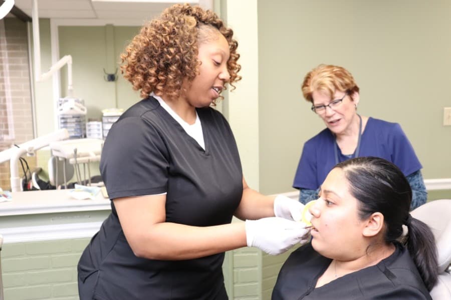 Lone Star College offers a variety of workforce education programs including one in dental assisting. COVID-19 protocols, such as face masks, are not present in this photo as it was taken prepandemic. (Courtesy Lone Star College System)