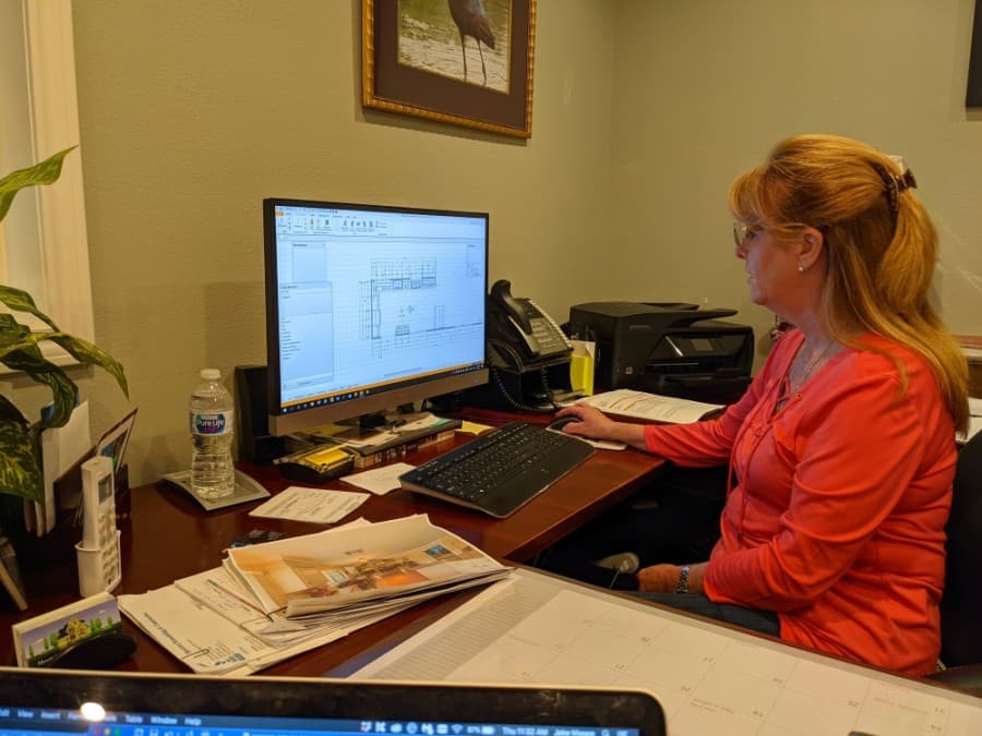 Kaysie Stampley uses computer programs to design kitchens B.J. constructs. (Jake Magee/Community Impact Newspaper)
