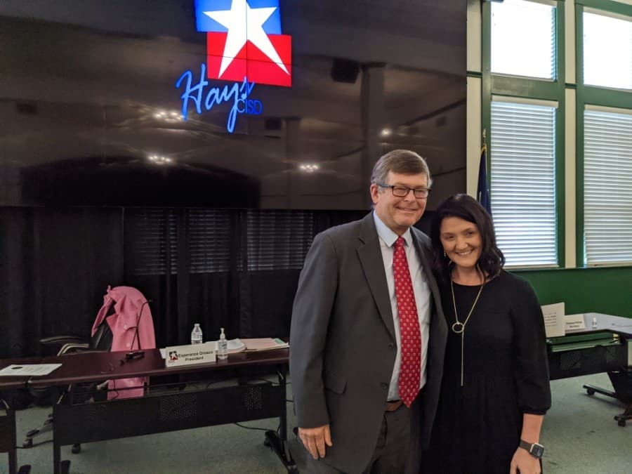 Hays County Precinct 2 Commissioner Mark Jones (left) swore in Hays CISD District 3 Trustee Courtney Runkle (right) during a May 17 meeting. (Warren Brown/Community Impact Newspaper)