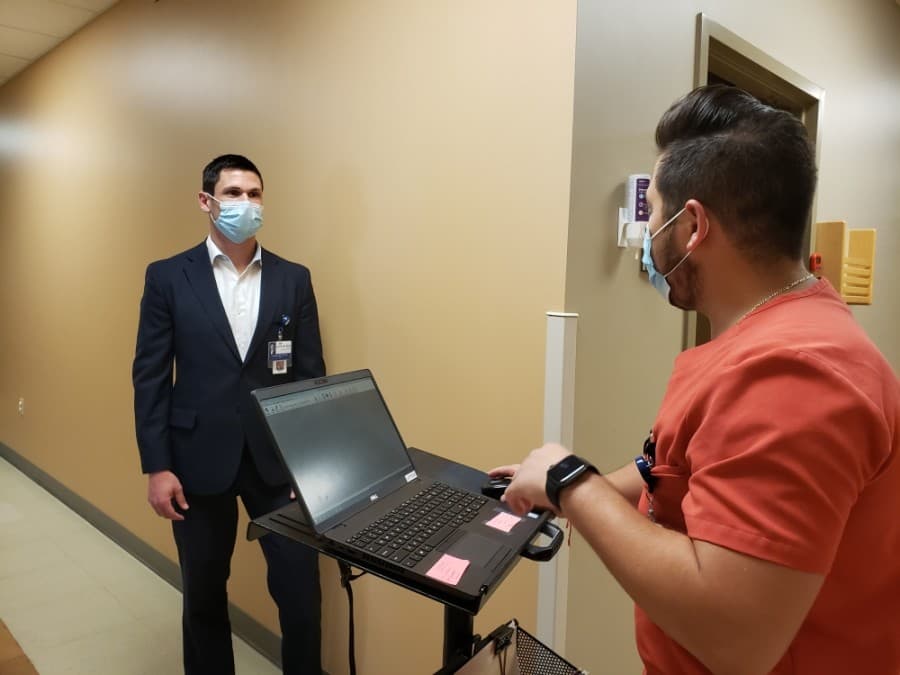 Mendoza and Calvin discuss LSCC Family Medicine operations. (Ali Linan/Community Impact Newspaper)