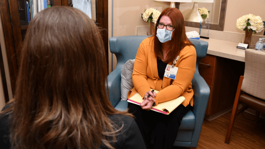 care manager providing patient with resources and support services