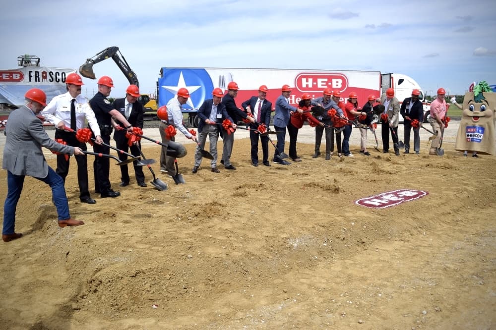 Frisco public officials and H-E-B executive staff break ground at the construction site for the grocery chain's first Frisco location. (Matt Payne/Community Impact Newspaper)
