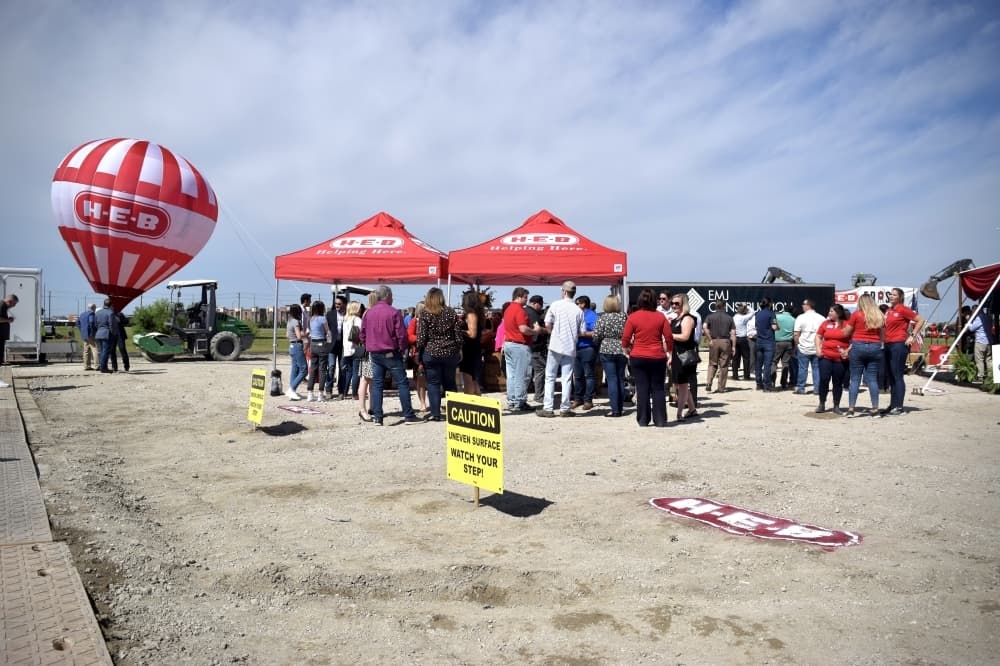 A crowd of more than 100 gathered at a private groundbreaking ceremony at the site of Frisco's future H-E-B location. (Matt Payne/Community Impact Newspaper)