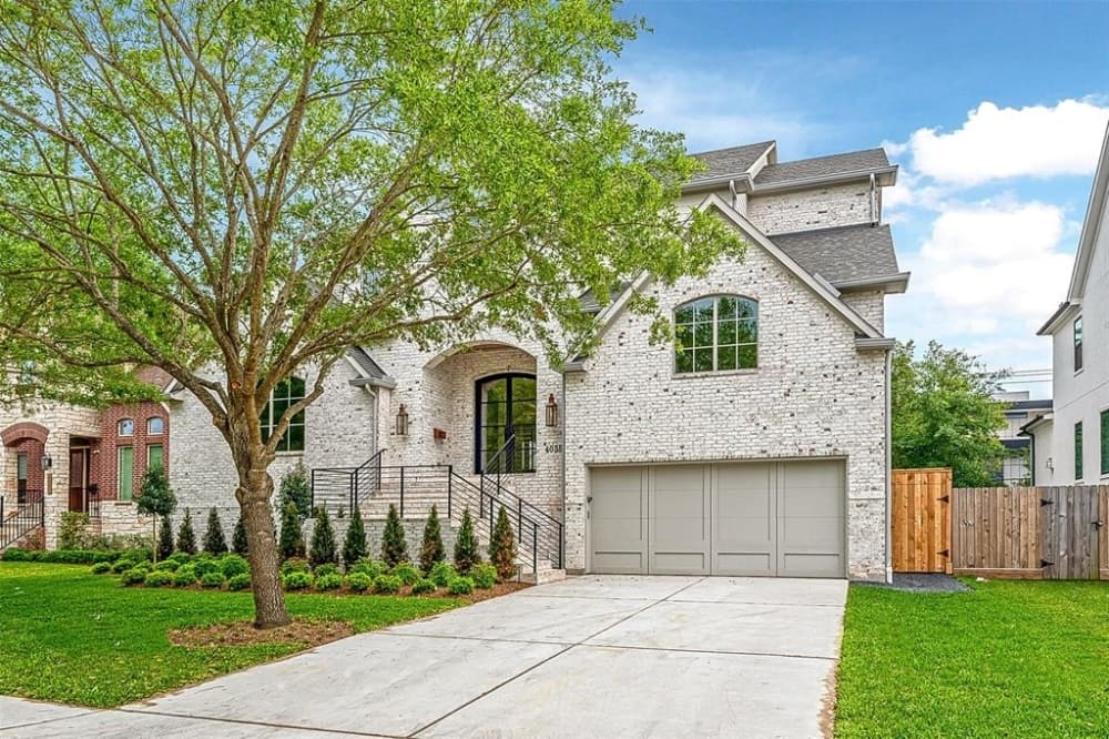 4035 Tartan Lane, Houston: A contemporary home newly built in 2021 close to Karl Young Park, Texas Medical Center, downtown, the Galleria, and NRG Stadium, this home’s front doors open to a wrought iron staircase. The main floor features a private office that has large windows viewing the neighborhood, and in addition features a chef’s kitchen with luxury finishes such as quartz countertops and backsplash, fire clay farmhouse sink, lighting sconces and custom vent hood that opens to living, breakfast and dining rooms. The primary bathroom is equipped with a rain shower, marble countertops, Italian porcelain floors and large closet. 5 bed, 4 full and 2 half bath/5,251 sq. ft. Sold for $1,638,001-$1,888,000 on May 28. (Courtesy Houston Association of Realtors)