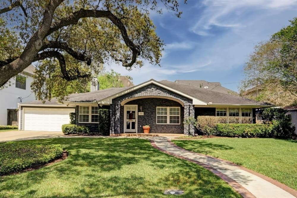 5102 Pocahontas St., Bellaire: Featured is a ranch-style home located in the heart of Bellaire on a wide, quiet street with an abundance of trees and within walking distance to Condit Elementary School, Bellaire High School, Bellaire Recreation Center, a library, a police station and more. It features a new gourmet kitchen with high-end appliances, a large island with seating and a family room lined with a wall of windows leading out to a flagstone patio. 4 bed, 3 full bath/2,814 sq. ft. Sold for $717,001-$827,000 on May 14. (Courtesy Houston Association of Realtors)