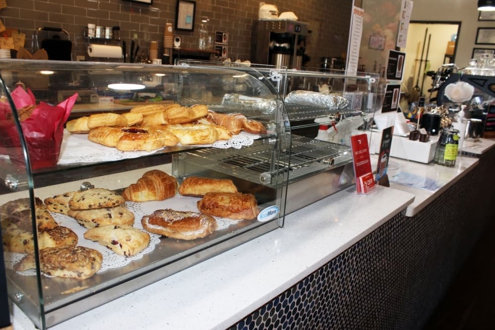 a counter display showcases bakery items available for purchase