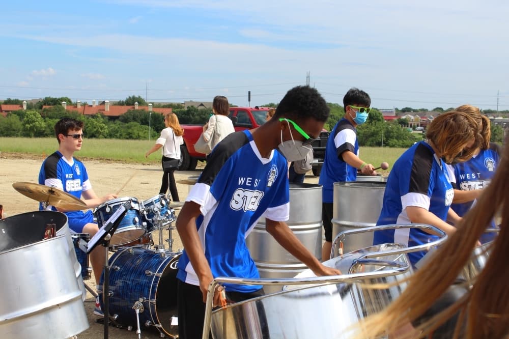 student playing drums