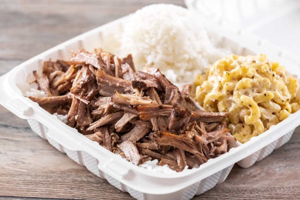 Notable menu items include Luau Pig, which is slow-roasted Kalua pork seasoned with Hawaiian sea salt. (Photo by Kathy Tran, courtesy Hawaiian Bros)