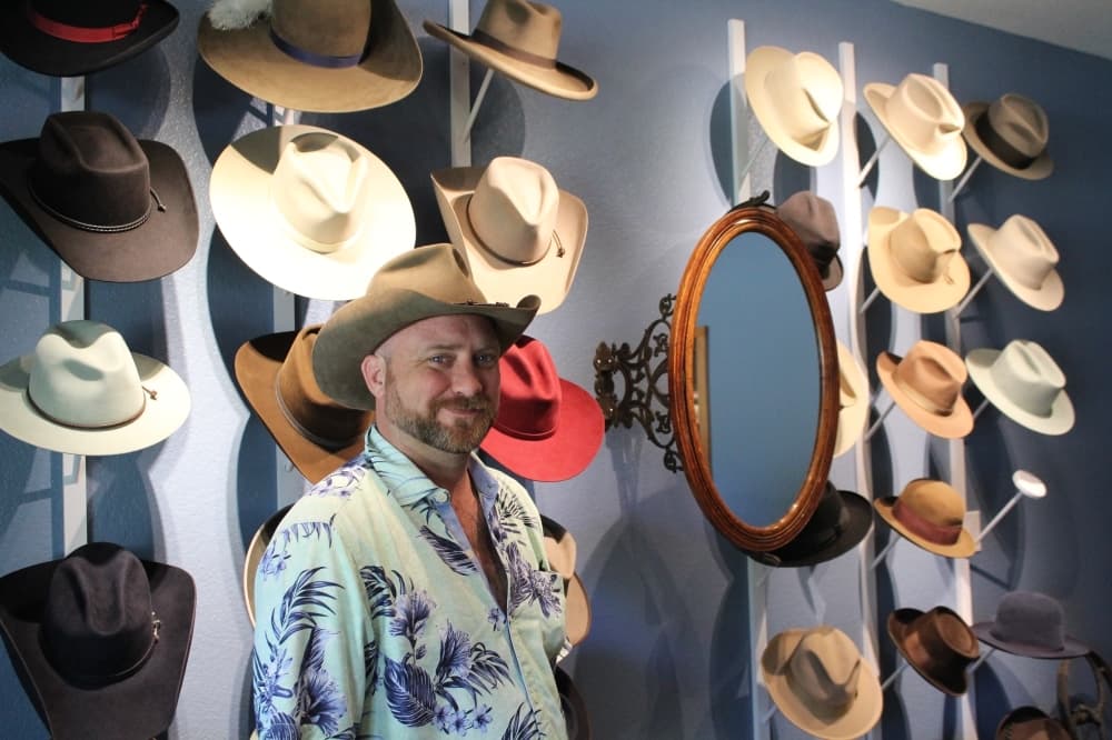 Jimmy Pierce, owner of Jimmy Pierce Designs, started crafting hats in 1998. (Megan Cardona/Community Impact Newspaper)
