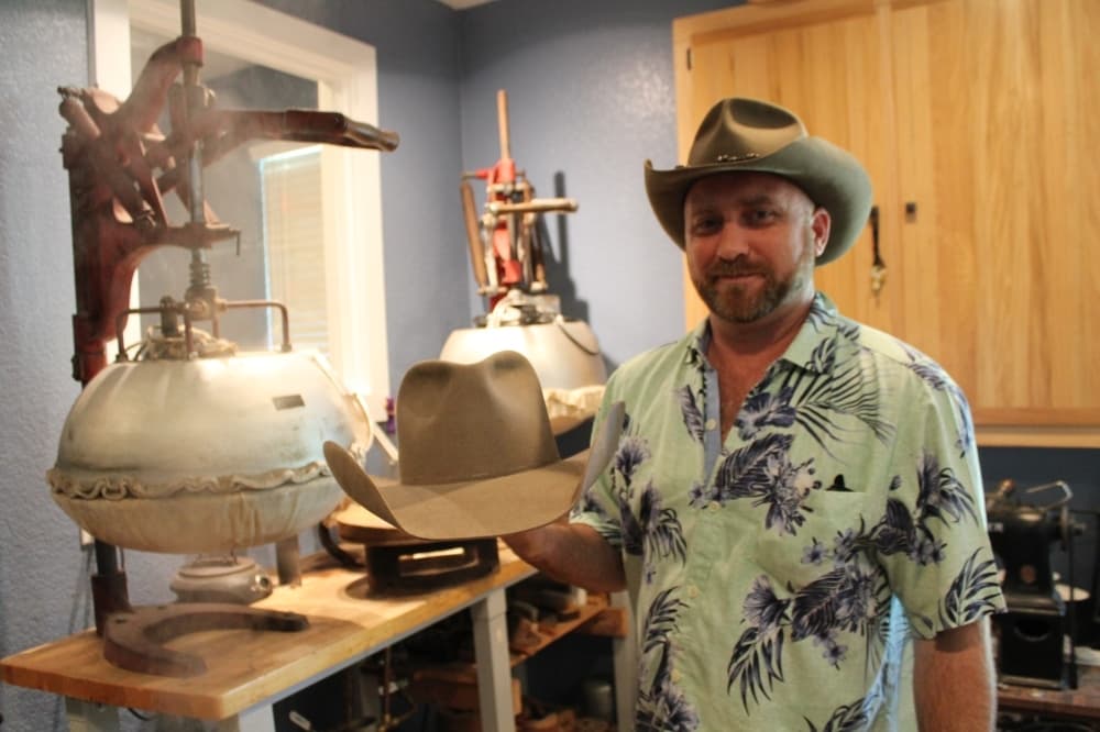 Jimmy Pierce completes shaping a hat. (Megan Cardona/Community Impact Newspaper)